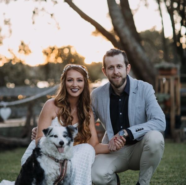 young couple with dog getting married
