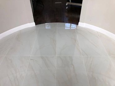 Foyer Tile with arch transition to hardwood floors