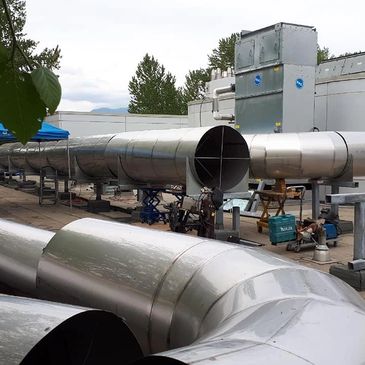 Stainless steel Kelowna Fabrication exhaust hoods sneeze guards dish tables countertops sinks ducts