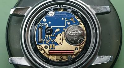 Close-up of a Swiss-made watch movement with intricate components.