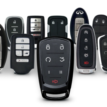 A collection of various modern car key fobs arranged together.
