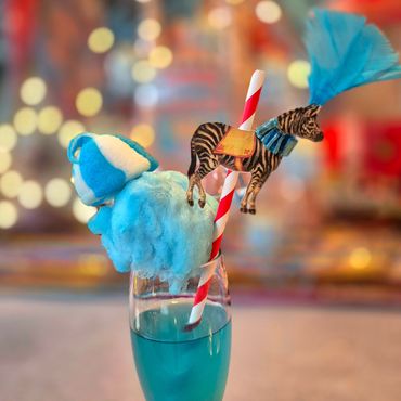 Circus themed mocktail with candyfloss, marshmallow and circus straw