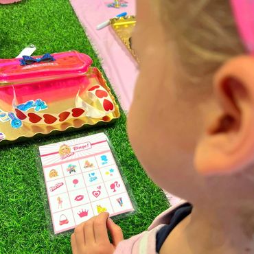 Party goer playing barbie bingo