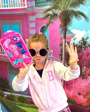 Photo of a party goer holding her craft