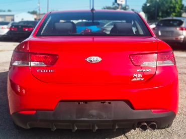 Rear view of a red Kia Forte Koup.