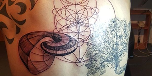 Geometric sea-shell tattoo