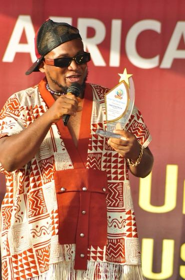Done Deal International Artist ONEOFAFRICA accepts The African Youth Tourism Award