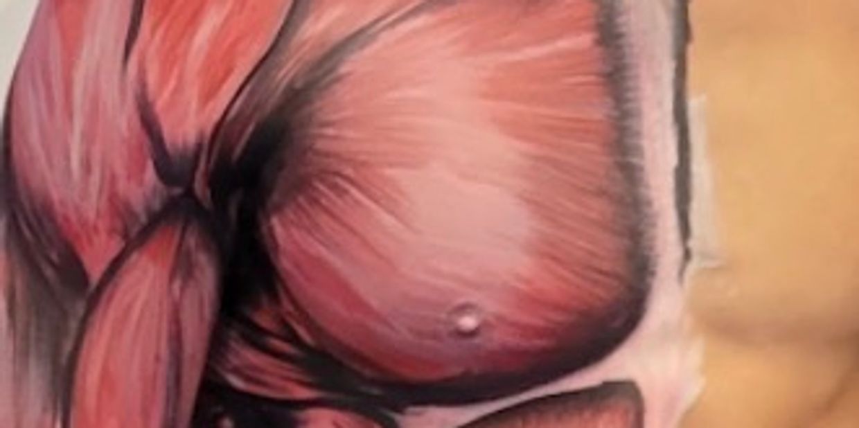 Chest muscle anatomy tattoo on skin.