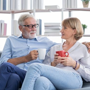 A couple sitting and talking over coffee, Couples Counseling Therapy