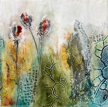 encaustic piece with 3 rust coloured flowers.  landscape in blues, greens, and oranges with ink