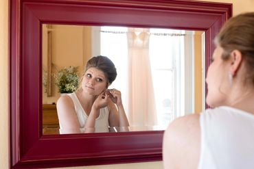 Wedding Photography, Ramsdell Inn Manistee Michigan, Bride Putting jewelry on, LeGalley Photography 