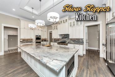 Elegant Show Stopper Kitchen with Quartzite backsplash!