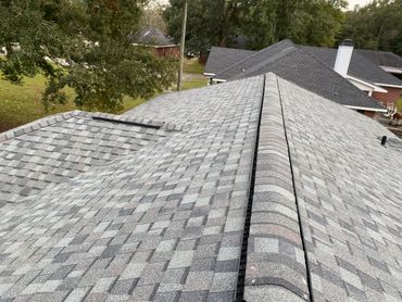 New shingle roof with ridge caps and venting