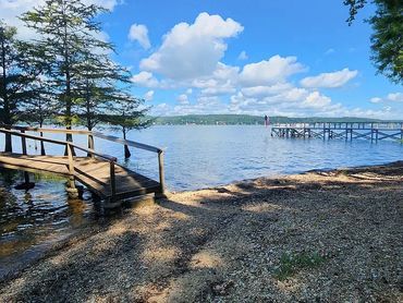 View of shoreline with a wooden dock.