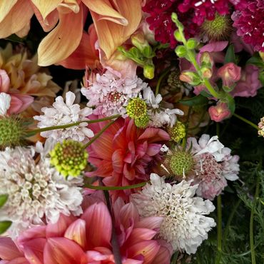 A vibrant close-up of a mixed bouquet with various colorful flowers.