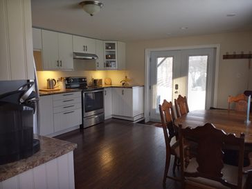 Spacious  Fully equipped Kithchen and walk out patio to the water