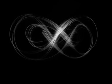 Artistic light beam in the shape of the infinity symbol taken during a long exposure shot