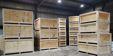 Stacked wooden crates in a warehouse.