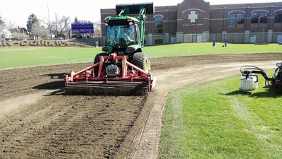 Vertical tilling baseball infield surface before grading-  Reduces compaction, improves drainage