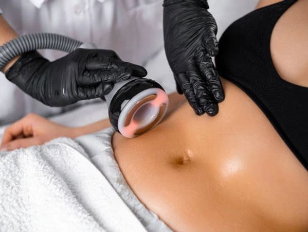 A cosmetic treatment device is applied to a woman's abdomen.