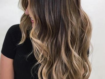 a women with a balayage done at a beauty salon