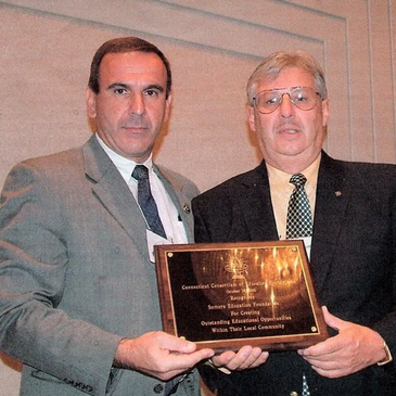 Photo:  Lou Bachetti (R), SEF President, accepting award for Best New Foundation of the Year in 2004