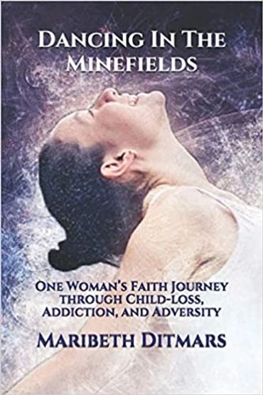 Book cover, A woman smiling and looking up while dancing titled Dancing In The Minefields.