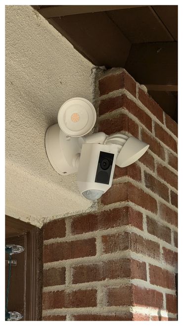 Smart floodlight with camera