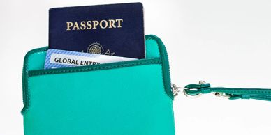 Global Entry membership card and passport in travel wallet, Travel-Mingo resource.