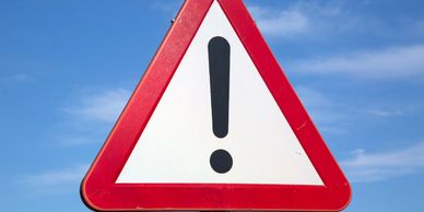 Red bordered caution sign, Travel-Mingo safety update.