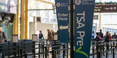 TSA Pre-Check sign at airport security, Travel-Mingo resource.