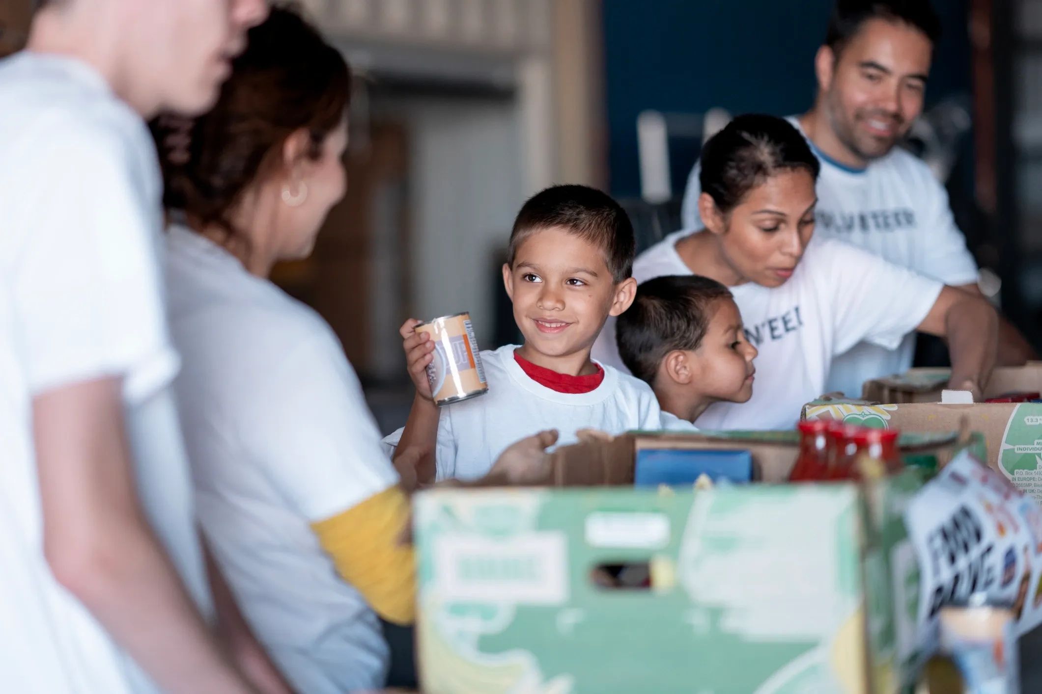 Group of people volunteering with food donations.