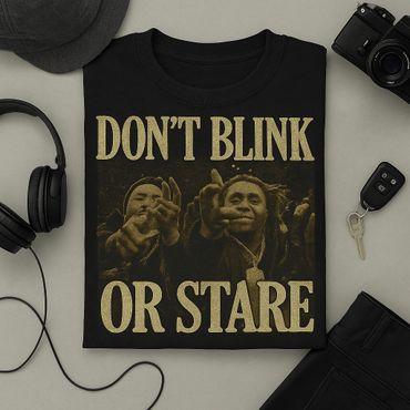 Black T-shirt with a bold message and image of two people pointing.