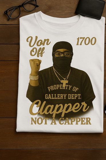 White t-shirt with a graphic of a masked man and the text "Clapper Not A Capper."