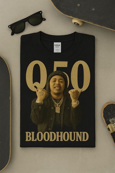 Black t-shirt with gold design, sunglasses, and skateboards.