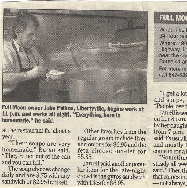 John Psihos working in his restaurant kitchen at night.