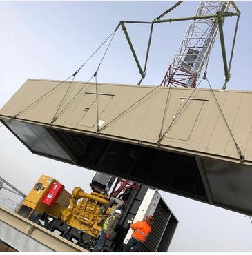 BMG Rigging using a tower crane to hoist emergency generator for new hospital in Brooklyn