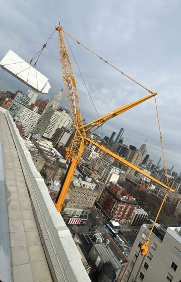 Rigging of a rooftop HVAC Unit with Liebherr crane with luffing jib in New York City