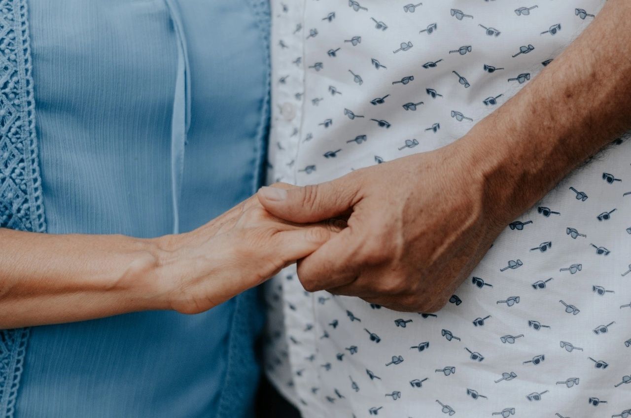 A couple holding hands. A couple holding hands.