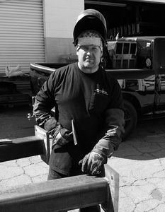 A man wearing welding gear