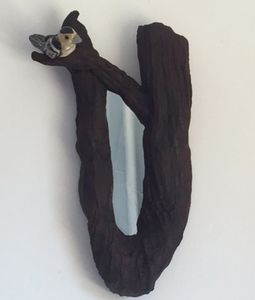 Branch mirror frame with small grey brd