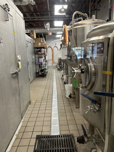 a view of the brewery production space behind the bar