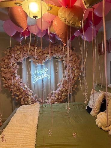 Flower heart arch with different shades of pink latex and heart foil balloons