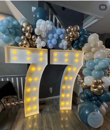 77th Birthday Marquee light up numbers with shades of light blue, dusty blue, gold and white balloon