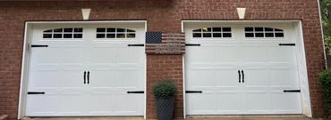 White carriage garage doors with windows installed in Forsyth County, GA by BB Garage Doors.