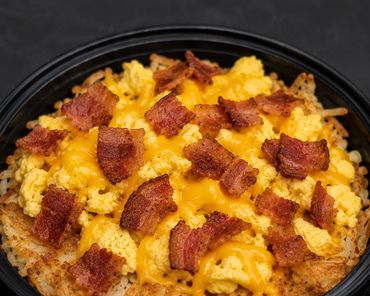 Bacon, eggs and cheese on golden brown hashbrowns