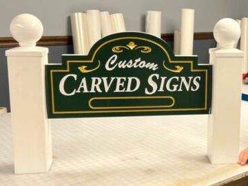 Carved signs and sandblasted signs are classic and show attention to detail!