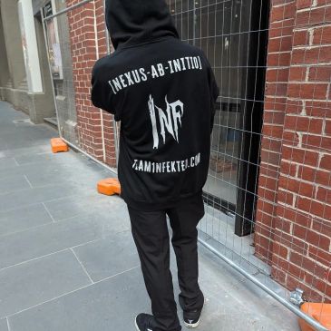 Person wearing a black hoodie with white text on the back.