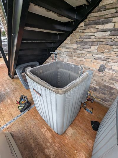 Condenser being serviced with top removed, by HVAC Pro Help, Dandridge TN.