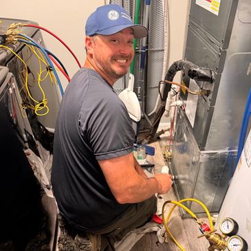 Josh, owner of HVAC Pro Help, at work